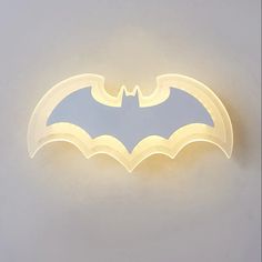 a light up batman symbol on the wall