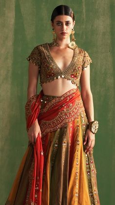 This set includes Multi-colored silk lehenga with blouse and dupatta. Blouse has heavy hand embroidery with sequence, dori cut dana, sippi, sequence and metal work paired with beautiful heavy dupatta. Multi Color Lehenga, Lehenga With Blouse, Heavy Dupatta, Fusion Wear, Silk Lehenga, Indo Western, Metal Work, Indian Wear, Multi Colored