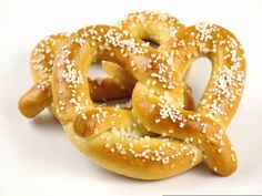 two pretzels with sesame seeds on them