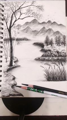 a pencil drawing of a lake with mountains in the background