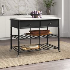 a kitchen island with marble top and metal legs