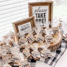 a table topped with lots of signs and candies on top of a wooden slice