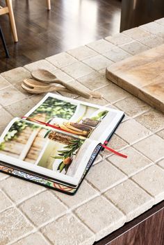 an open magazine sitting on top of a kitchen counter