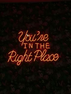 a neon sign that says you're in the right place