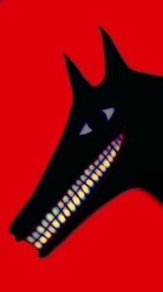 a black dog with its mouth open on a red background