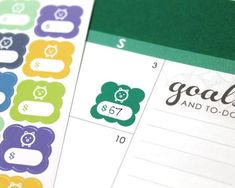 a calendar with colorful stickers on it and the words goals written in different languages