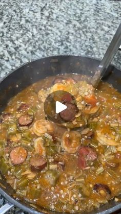 a large pan filled with food on top of a stove