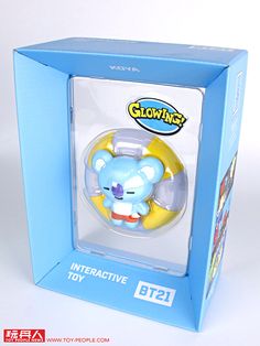 a blue box with a toy in it's display case on a white surface