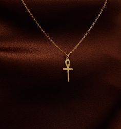 * A N K H * N E C K L A C E * Elevate your style with our 14K solid gold tiny Ankh necklace, a delicate and meaningful piece that carries the rich heritage of ancient Egypt. This dainty gold Ankh pendant, though small in size, is a powerful symbol of life and eternal protection. Whether you're drawn to the luxurious 14K gold or the sleek silver finish, this minimal Ankh necklace is a perfect addition to your jewelry collection. Designed for those who appreciate understated elegance, this Egyptia Traditional Ankh Necklace For Gifts, Ankh Pendant, Jewelry Minimal, Egyptian Ankh, Ankh Necklace, Life Symbol, Ancient Symbols, Understated Elegance, Adjustable Necklace