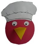 a paper bird with a chef's hat on it's head and eyes