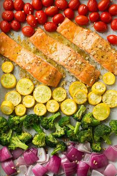 salmon, tomatoes, broccoli and onions on a tray