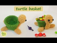 two crocheted stuffed animals sitting next to each other on top of a table