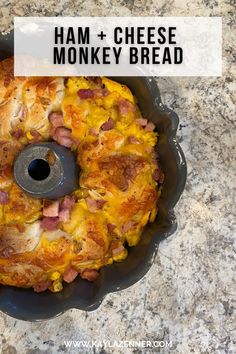 a casserole dish with ham and cheese in it on a marble counter top