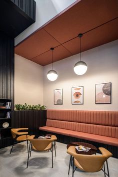 an empty waiting area with chairs and tables