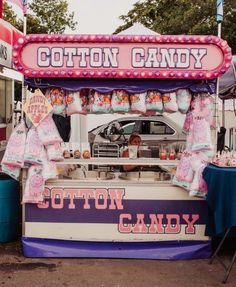 a cotton candy stand at an outdoor fair