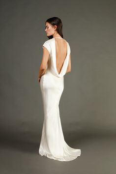 the back of a woman in a white dress