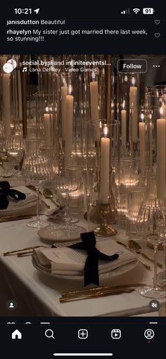 the table is set with candles and place settings for dinner guests to sit down at