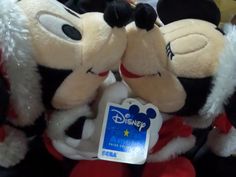 two stuffed mickey mouses sitting next to each other