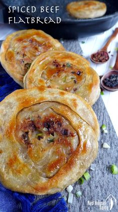 three homemade spiced beef flatbreads on a table