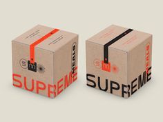 two cardboard boxes with the words supreme printed on them