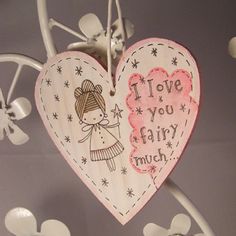 a heart hanging from the ceiling with words above it that read i love you fairy much