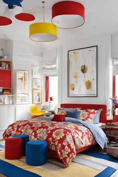 a bedroom with red, yellow and blue bedding in it's center area