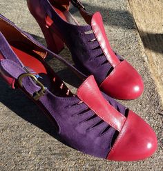 two pairs of purple and red shoes on the ground