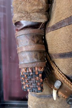 a horse's boots and bridles are displayed in a display case