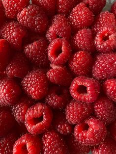 a bunch of raspberries sitting on top of each other