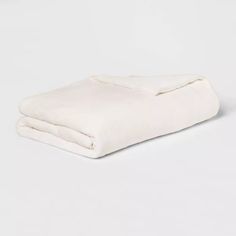 a white blanket folded on top of each other