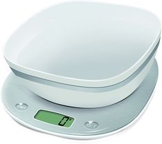 an electronic scale with a white bowl on top