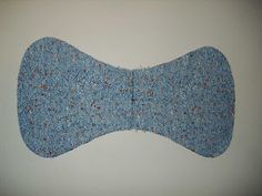 a blue bow tie hanging on the wall