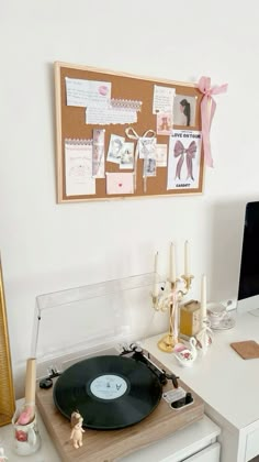 a record player sitting on top of a white desk