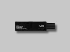 a black tube with the word fauve written on it, against a gray background