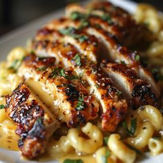 some chicken and macaroni on a white plate