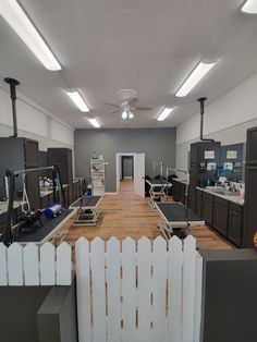 an empty room with several appliances in it and some lights on the ceiling above them