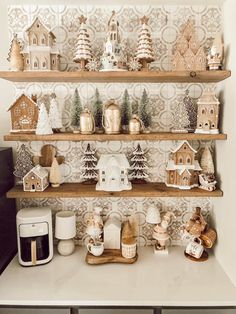 a shelf filled with christmas decorations on top of a counter