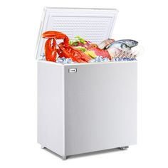 the chest freezer is full of fresh seafood and other things that are in it