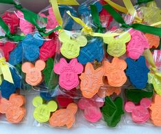 several plastic mickey mouse shaped cookies in bags