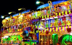 the carnival rides are brightly lit up at night