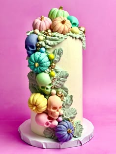 there is a cake decorated with skulls and flowers