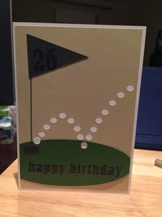 a birthday card with an image of a golf ball hitting the green