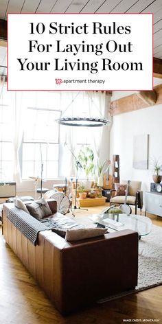 a living room filled with furniture and lots of windows