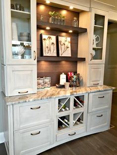 an image of a kitchen with white cabinets and marble counter tops on pinterest