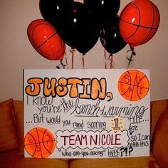 a basketball themed birthday party sign with balloons