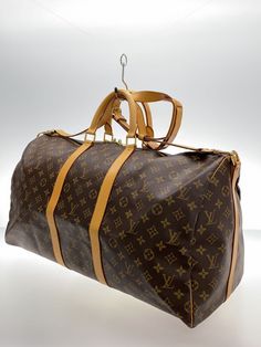 LOUIS VUITTON Keepall Bandouliere 50 Monogram Canvas BRW/PVC/BRW Authentic Description Condition: Used LOUIS VUITTON Keepall Bandouliere 50 Monogram Canvas BRW/PVC/BRW Authentic Model number M41416 color brown pattern Material: PVC (vinyl) Actual size Handle: 33 / Gusset: 24.5 / Height: 31.5 / Width: 55.5 Payment Please pay within 5 days after the auction closed. Shipping Please check "shipping & payments". if you don't understand, feel free to contact us with any questions Returns Returns are accepted ONLY if the item was not the item described. International Buyers - Please Note:  * Import duties, taxes and charges are not included in the item price or shipping charges. These charges are the buyer's responsibility.  * Please check with your country's customs office to determine what thes Authentic Models, Used Louis Vuitton, Louis Vuitton Keepall, Brown Pattern, Pvc Vinyl, Monogram Canvas, Bags Handbags, 50 %, Shoe Accessories