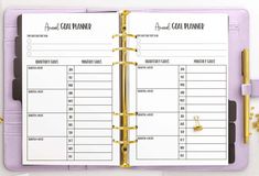 an open planner book with gold trimming