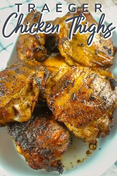 grilled chicken thighs on a white plate with text overlay that reads, traeger chicken thighs