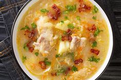 a bowl of soup with meat and cheese