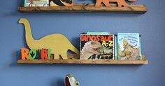 two wooden shelves with books and toys on them